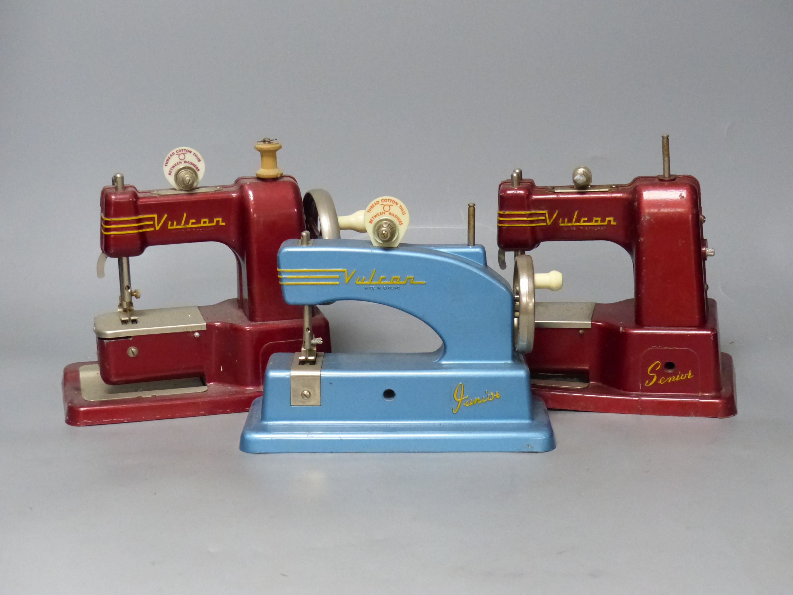 Three vintage hand sewing machines